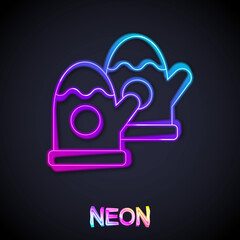 Glowing neon line Pair of knitted christmas mittens icon isolated on black background. Mitten icon. Merry Christmas and Happy New Year. Vector