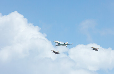 Military aircraft against the blue sky