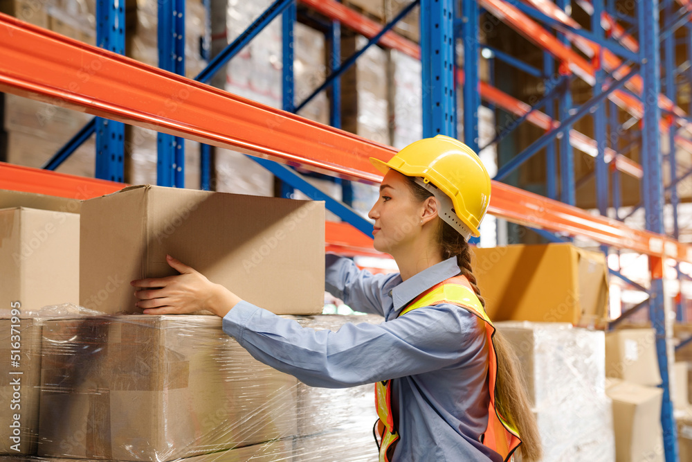 Wall mural women warehouse employee worker enjoy working in warehouse, logistic industry concept.