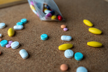 Pharmaceutical medicine pills in both tablets and capsules with the vintage retro picture style. Pharmacy theme and treatment medication as concept.	