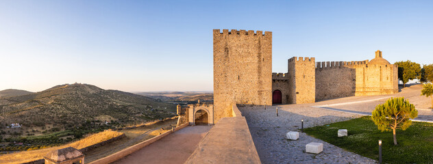 Elvas, Portugal: Castelo of Elvas with the fort "Forte da Graca" on the hill to the left. Panoramic image from several single images - shot at sunset.