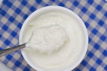 fresh yogurt in a bowl on table 