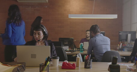 Group of young business people working at the office. Employees startup staff