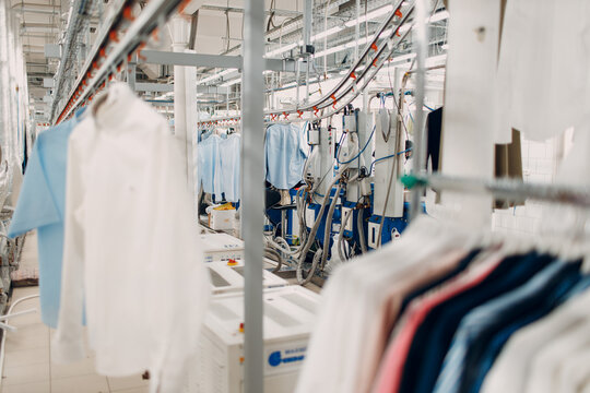Dry cleaning clothes. Clean cloth chemical process. Laundry industrial dry-cleaning.