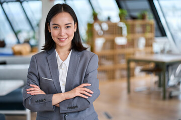 Young confident smiling Asian business woman leader, successful entrepreneur, elegant professional...