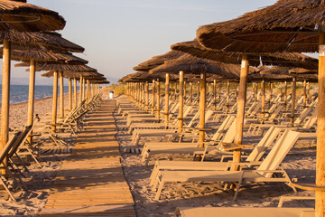 Obraz na płótnie Canvas Umbrellas on the beach. Sand beach in Kos Island, Greece, Aegean Sea, 