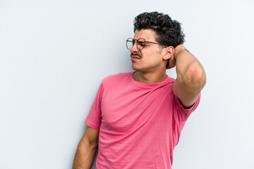 Young caucasian man isolated on blue background tired and very sleepy keeping hand on head.