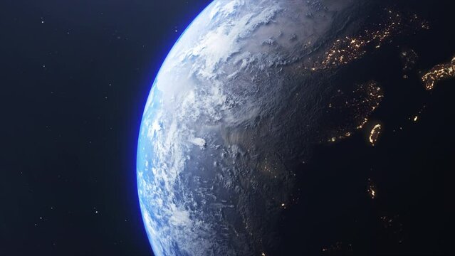 Fly over the spinning planet Earth. Day to night transition as seen from space. Glowing bright city lights shine. Animation of Earth seen from space, the globe spinning on satellite view on dark backg
