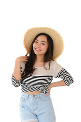 portrait of happy young asian female smiling posing with straw hat in summer dress isolated on white background. Leisure and summer travel concept.