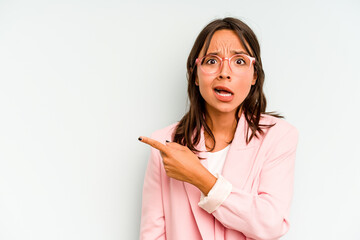 Young hispanic woman isolated on blue background showing rock gesture with fingers