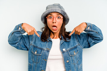 Young hispanic woman isolated on blue background massaging elbow, suffering after a bad movement.