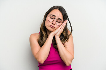 Young caucasian woman isolated on white background yawning showing a tired gesture covering mouth with hand.