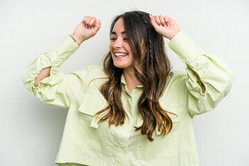 Fototapeta premium Young caucasian woman isolated on white background celebrating a special day, jumps and raise arms with energy.
