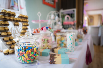 Table with buffet of sweets and desserts of all kinds for young and old at a wedding