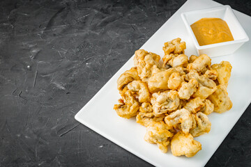 deep fried tempura vegetables on a dark background