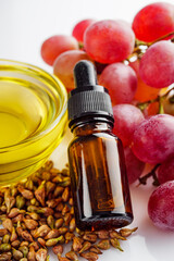 grape seed essential oil on a white background