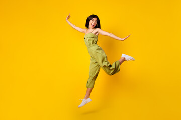 Fototapeta na wymiar Full body portrait of nice lovely person jumping have good mood rejoice isolated on yellow color background