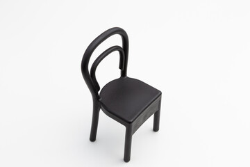 a black plastic chair on a white background