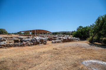 Fototapeta na wymiar Ancient archaeological site in Crete with stone ruins