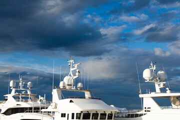 Mast of a large luxury yacht with navigation equipment, bottom view. Radars, signal lights,...