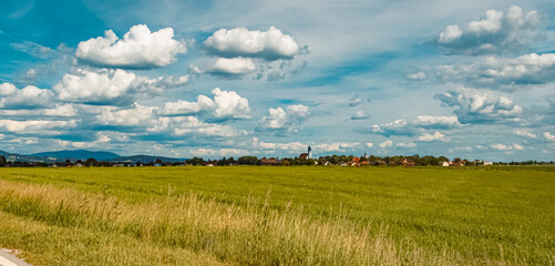 Fototapeta premium Beautiful summer view with dramatic clouds near Rettenbach, Bavaria, Germany