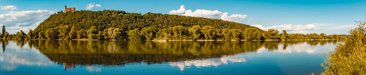 High resolution stitched panorama with reflections near the famous Bogenberg mountain, Bogen, Danube, Bavaria, Germany