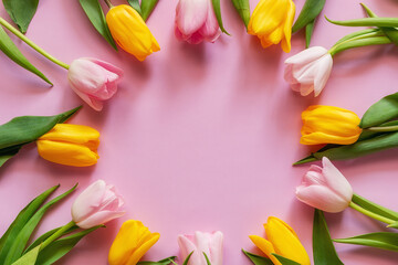 round frame of tulip flowers on a pink background mock-up with space for text