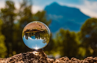 Crystal ball alpine landscape shot near Hellbrunn, Salzburg, Austria