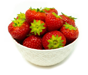 Red ripe strawberry in the white bowl white background