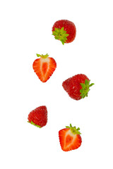 Isolated strawberries. Falling strawberry fruits whole and cut in half isolated on white background 