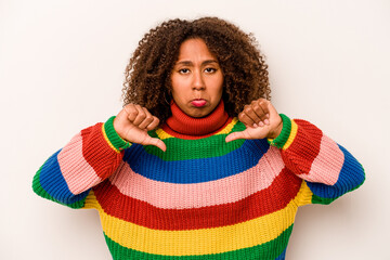 Young African American woman isolated on white background showing a dislike gesture, thumbs down....