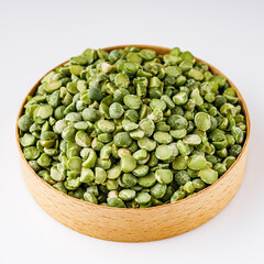 dried green peas on a white acrylic background