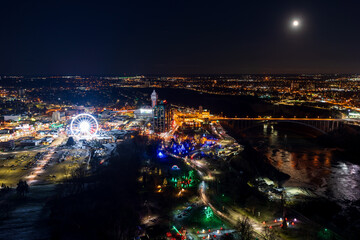 Niagara Falls City, Ontario, Canada - December 19 2021 : Overlooking the Niagara River Rainbow Bridge night view.