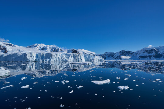 Antartic landscapes during a tripo across the Antartic peninsula with lot of icebergs, mountains and glaciers which land on the sea
