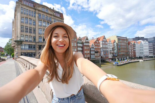 Traveler girl taking self portrait in Hamburg, Germany