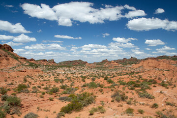 The red desert. View of the canyon, sandstone and rocky mountains under a blue sky.