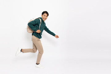 Happy young Asian man traveler running isolated on white background, Tourist male having cheerful holiday trip concept, Full body composition