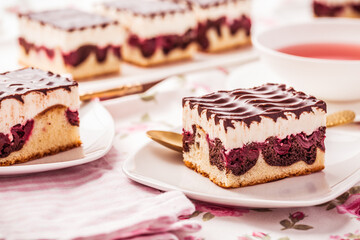 German cake Donauwelle (Danube waves) - vanilla and chocolate sponge cake with sour cherries,...