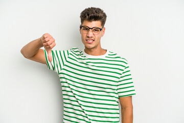 Fototapeta premium Young caucasian man isolated on white background showing thumb down, disappointment concept.