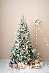 Wrapped gifts under the Christmas tree in a bright interior.