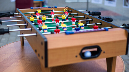 tabletop hand game football red and yellow teams with ball