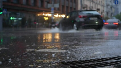 Shot of the asphalt of a city street with a river of water.
