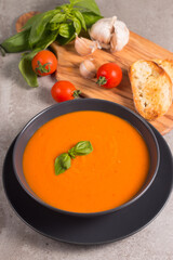 Tomato soup with basil.  Healthy, vegan and dieting lunch and dinner concept. Gazpacho. 