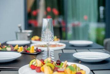 Glasses on the background of the laid table