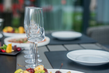 Glasses on the background of the laid table