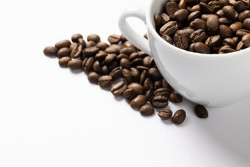 Image of pill of a coffee beans and cup of coffee beans on white background