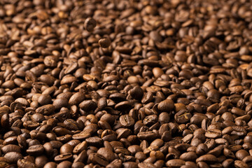 Image of close up of pile of roasting brown coffee beans
