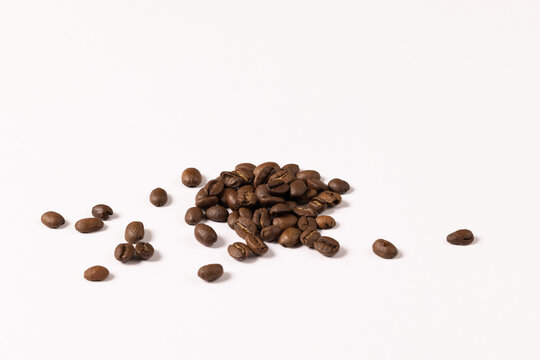 Image of pill of a coffee beans on a white background