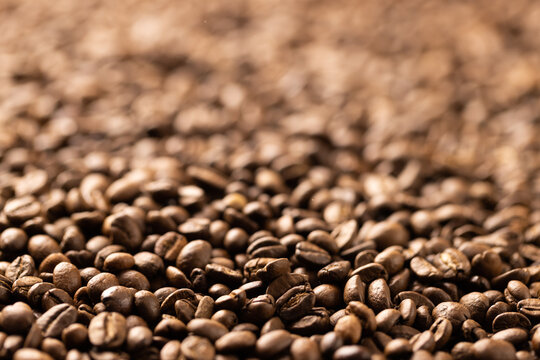Image of close up of pile of roasting brown coffee beans
