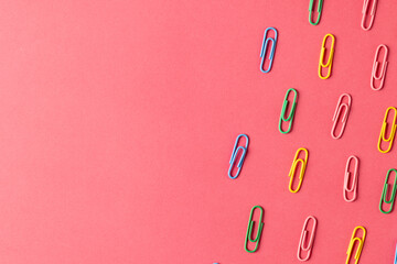 Composition of colorful clips on pin surface with copy space